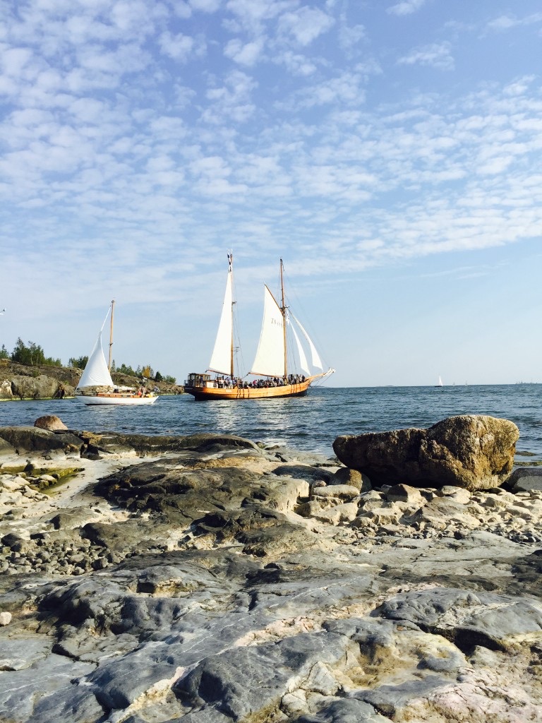 Sailboats off Helsinki's rocky shore on a late-summer day